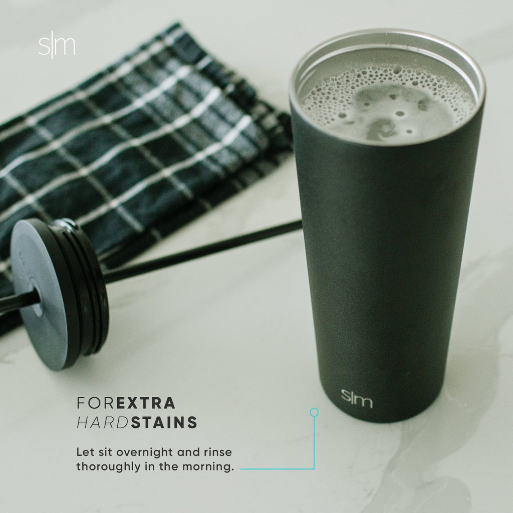 Sage green and gray matte ceramic mug and matching textile napkin on white background, displaying muted cool color palette