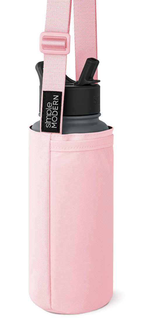 Soft pink cylindrical carrying case with charcoal gray and black accents, featuring a matching shoulder strap with webbing texture.