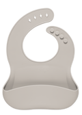 Soft beige bib with light taupe tone on white background