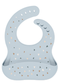 Light blue-gray baby bib with decorative triangular accents in tan, beige, caramel brown, and charcoal gray.