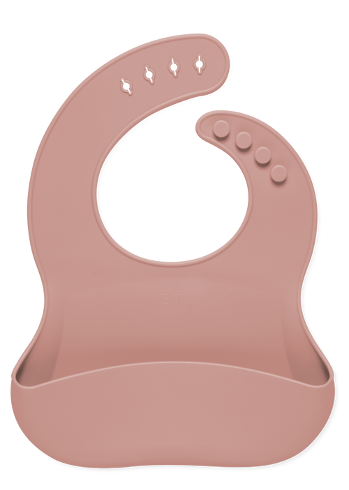 Dusty rose mauve baby bib displayed against a white background