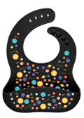 Black background with colorful celestial elements including bright yellow suns and stars, cyan and light blue planets, orange and coral circular shapes, and pink accents arranged in a decorative pattern