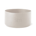 Pale cream-colored cylindrical vessel with soft gray interior walls against a neutral background.