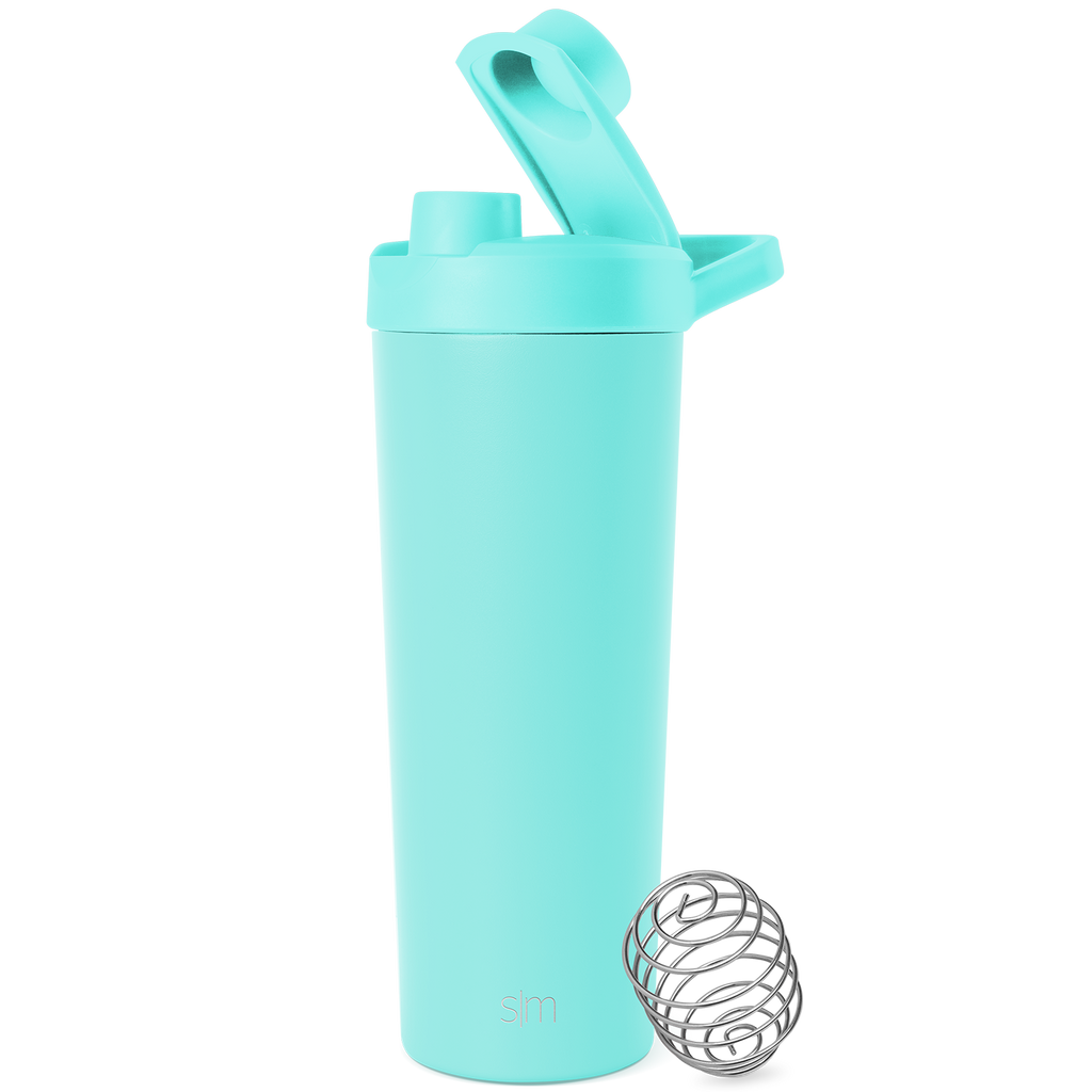 Soft pale turquoise container with stainless steel silver-gray mixing ball on white background