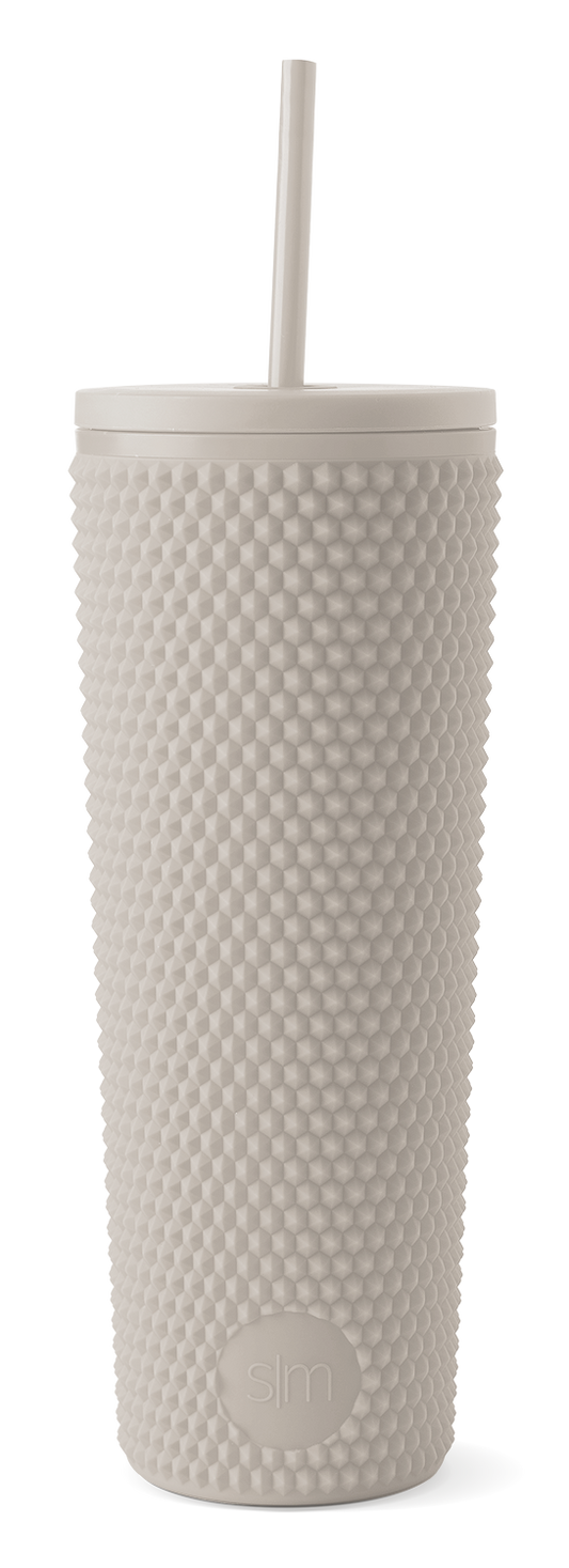 Cream-colored textured tumbler with modern design on white background