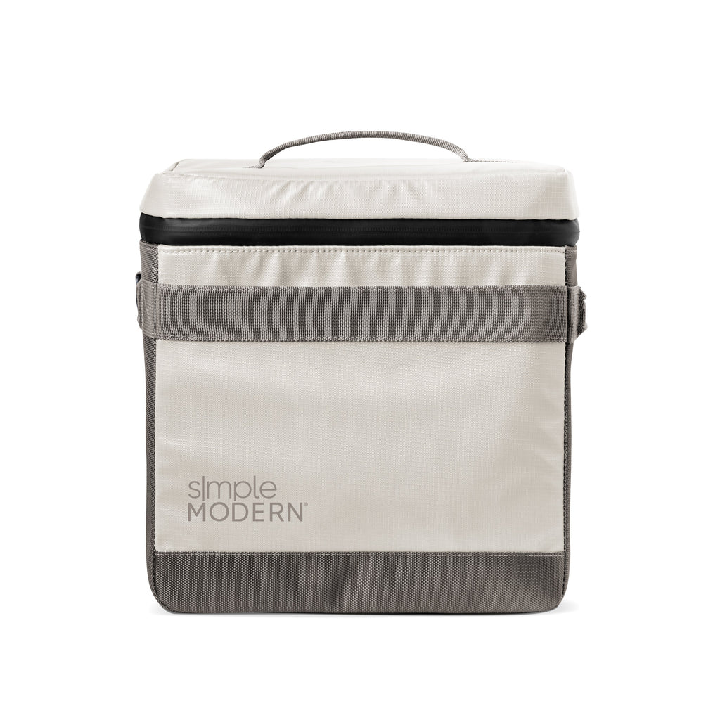Cream and charcoal gray color block tote bag with black accent band, featuring minimalist design with structured silhouette.