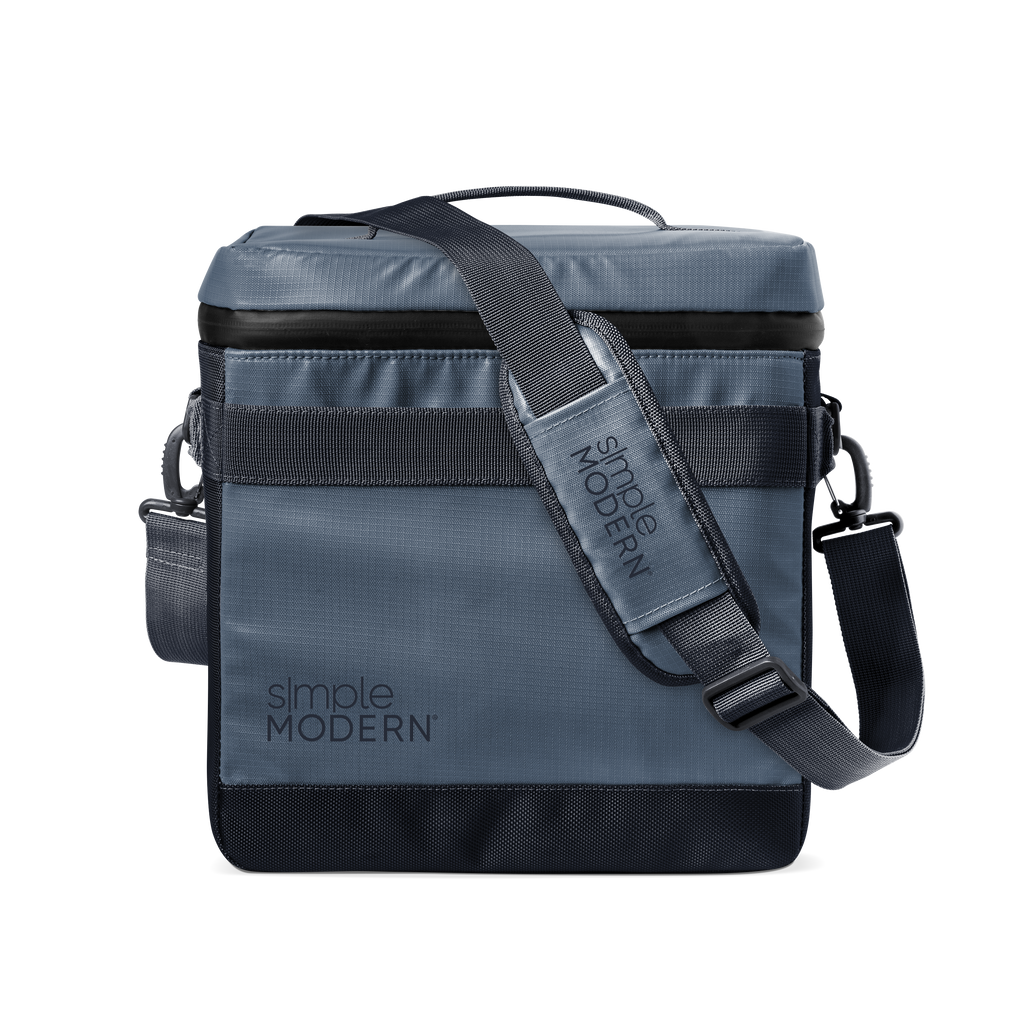 Slate blue-gray crossbody bag with black webbing strap and black accent details, modern neutral design
