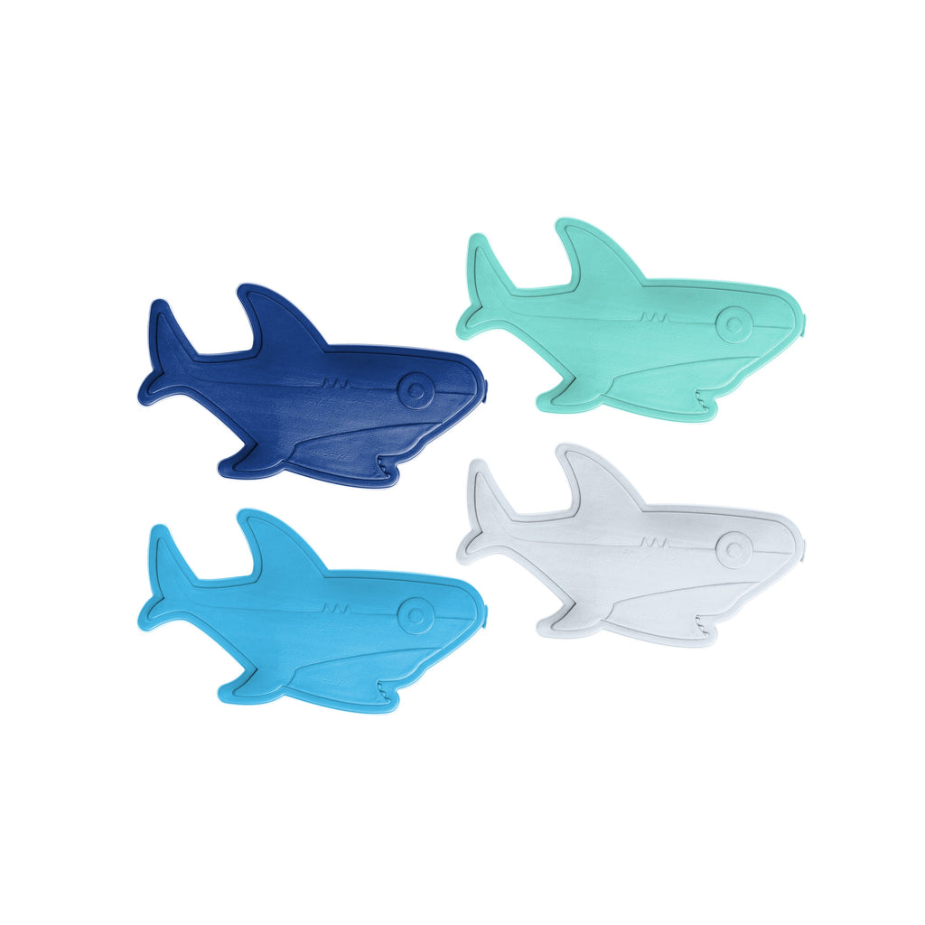 Four shark-shaped objects in dark navy blue, bright turquoise, cyan blue, and light gray colors arranged against a neutral background.