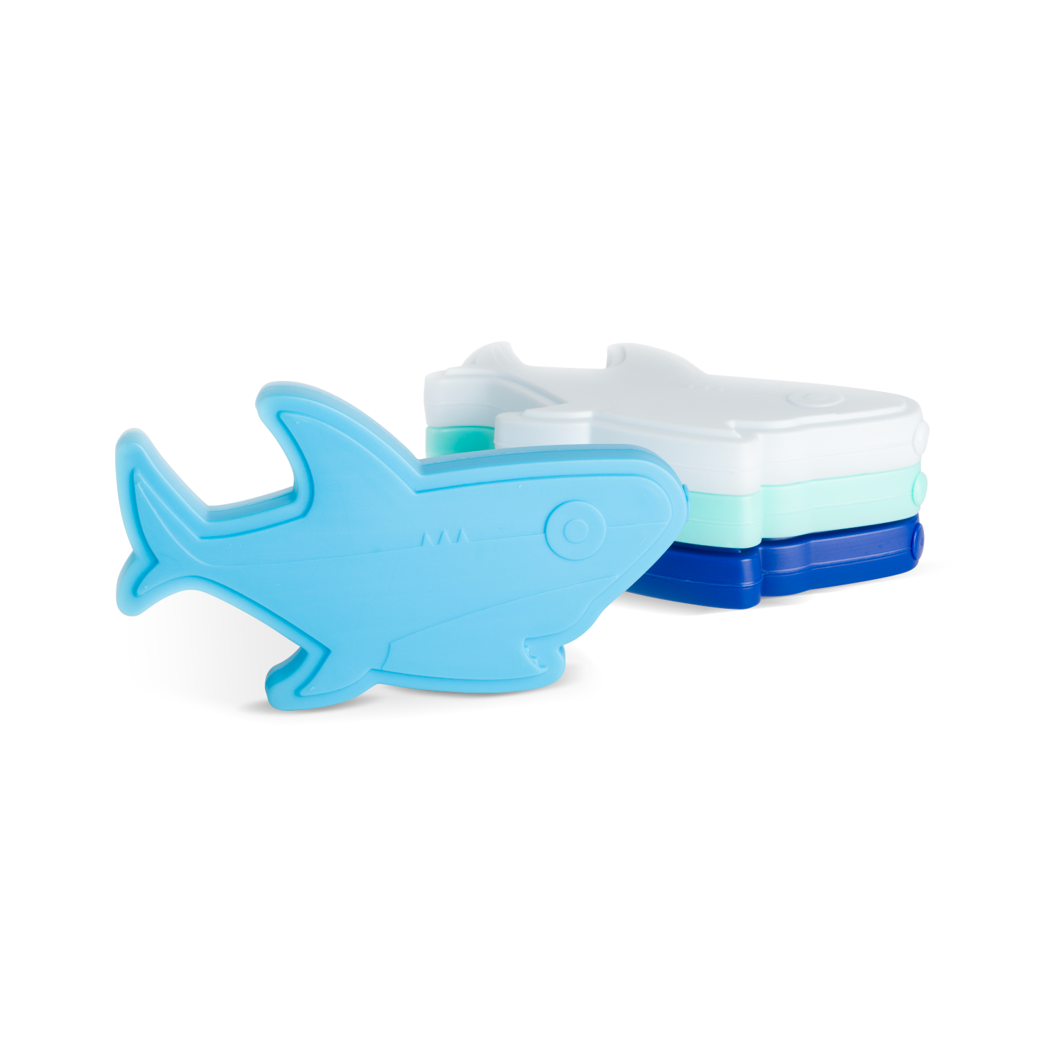 Four stackable shark-shaped ice cube trays in sky blue, mint green, white, and navy blue arranged against a white background.