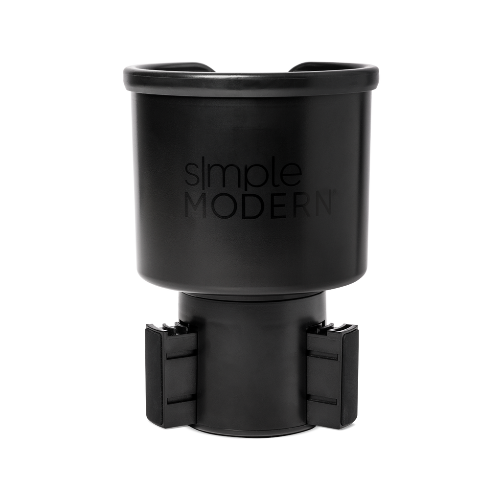 Black matte travel mug with front opening lid displayed against white background