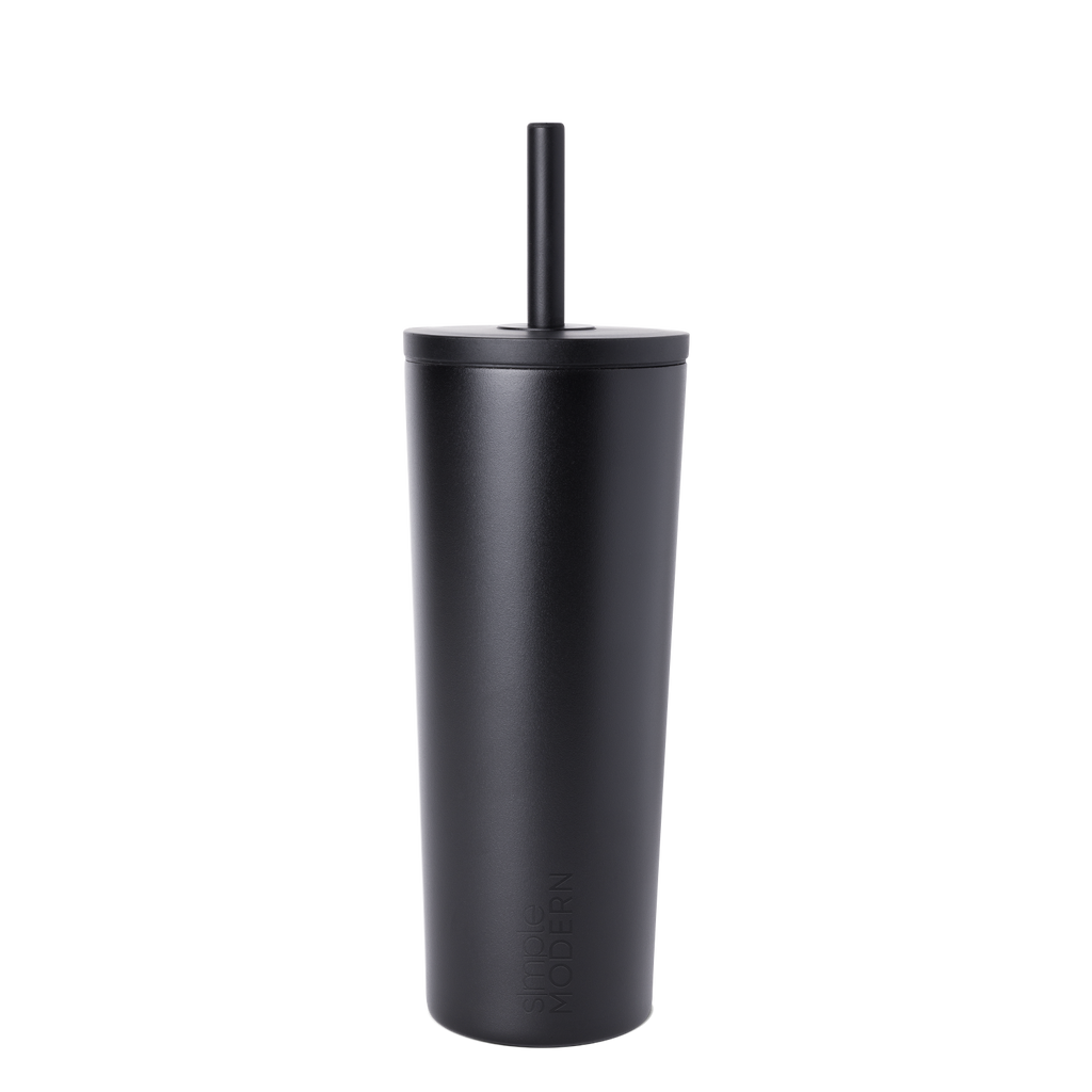 Matte black reusable cup with matching black straw on white background
