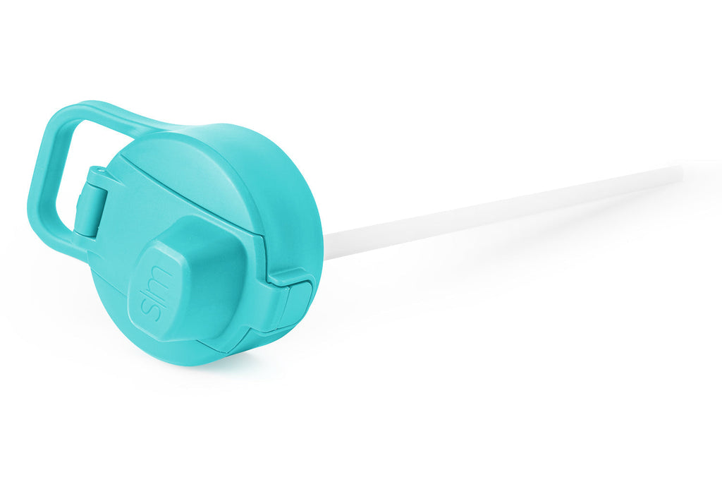 Bright turquoise reusable straw or tube on white background
