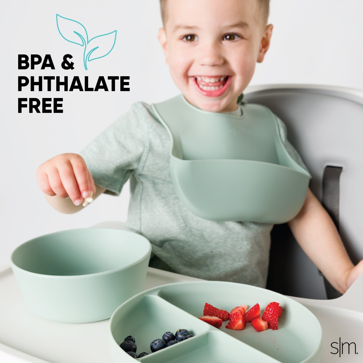 Sage green silicone toddler dinnerware set on white background, BPA-free children's mealtime products