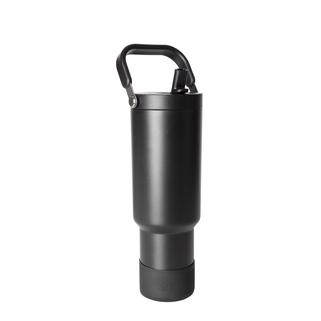 Black matte finish bottle with metallic gray accents, handle, and base against dark gray background