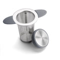 Stainless steel tea infuser with mesh basket and brushed metal components on white background