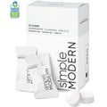 White cleaning tablets in transparent pouches next to white packaging box with black text, displayed against white background with gray shadows